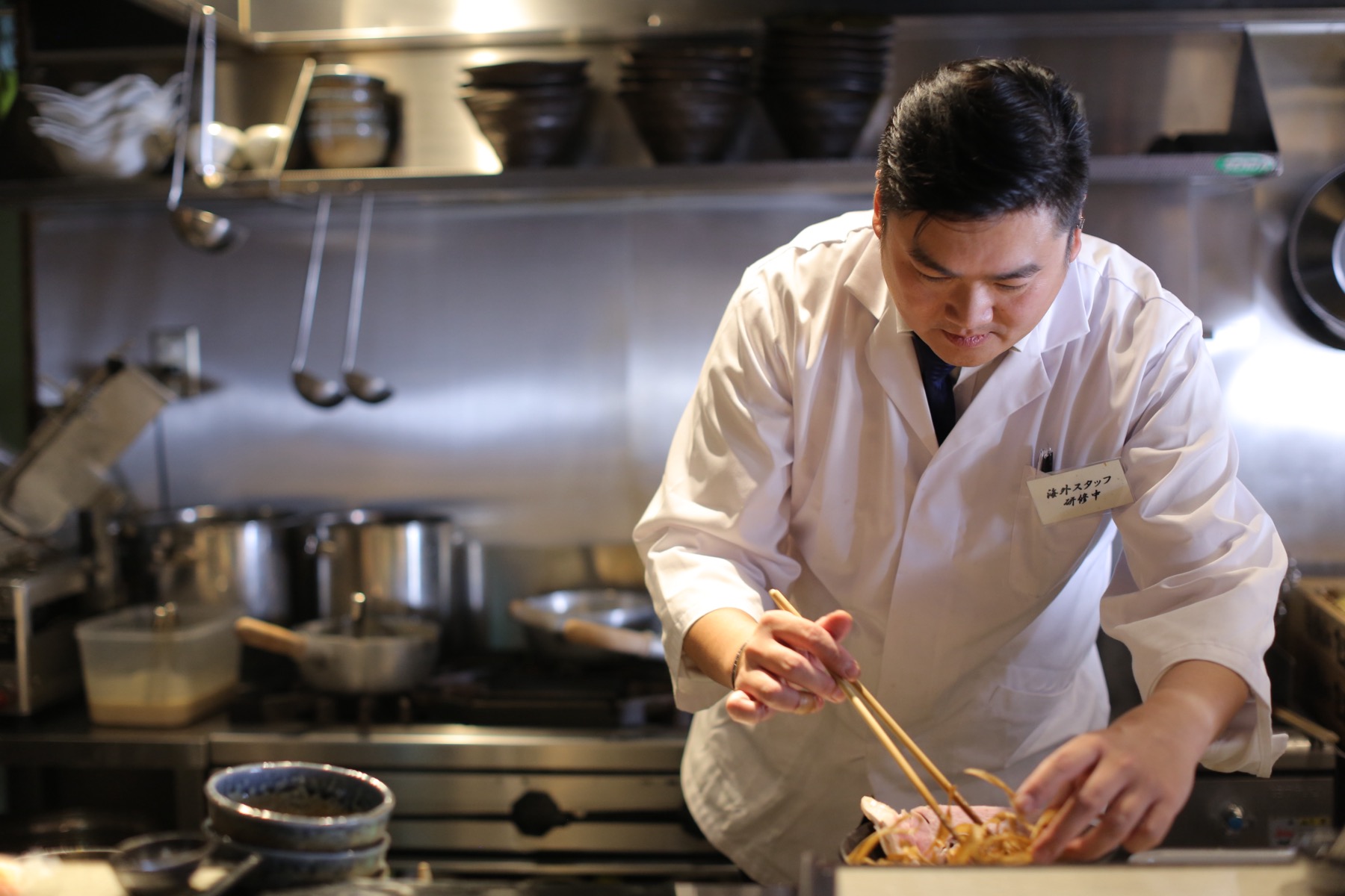 Chef preparing a dish in the Zagin Soba kitchen