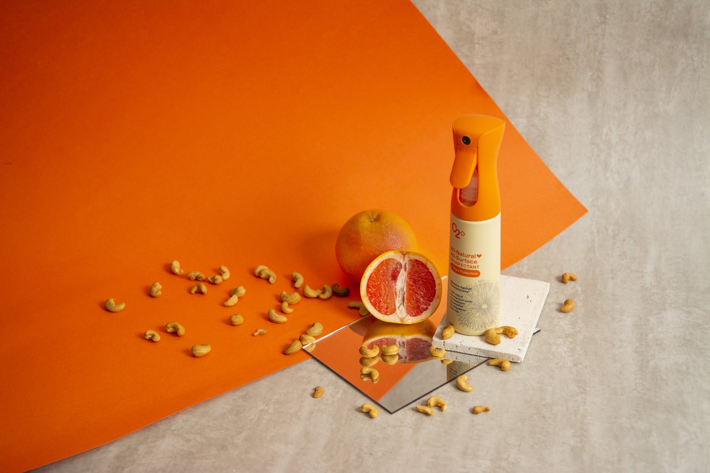 C2 Plus surface disinfectant styled with citrus and cashews